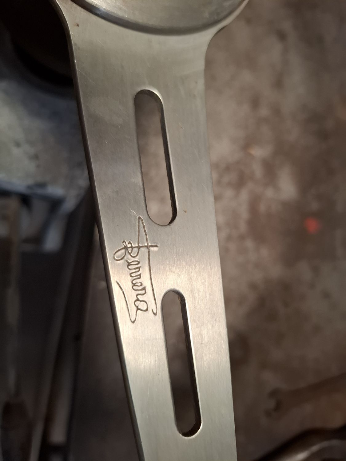 The engraved Ferrero signature on the spoke