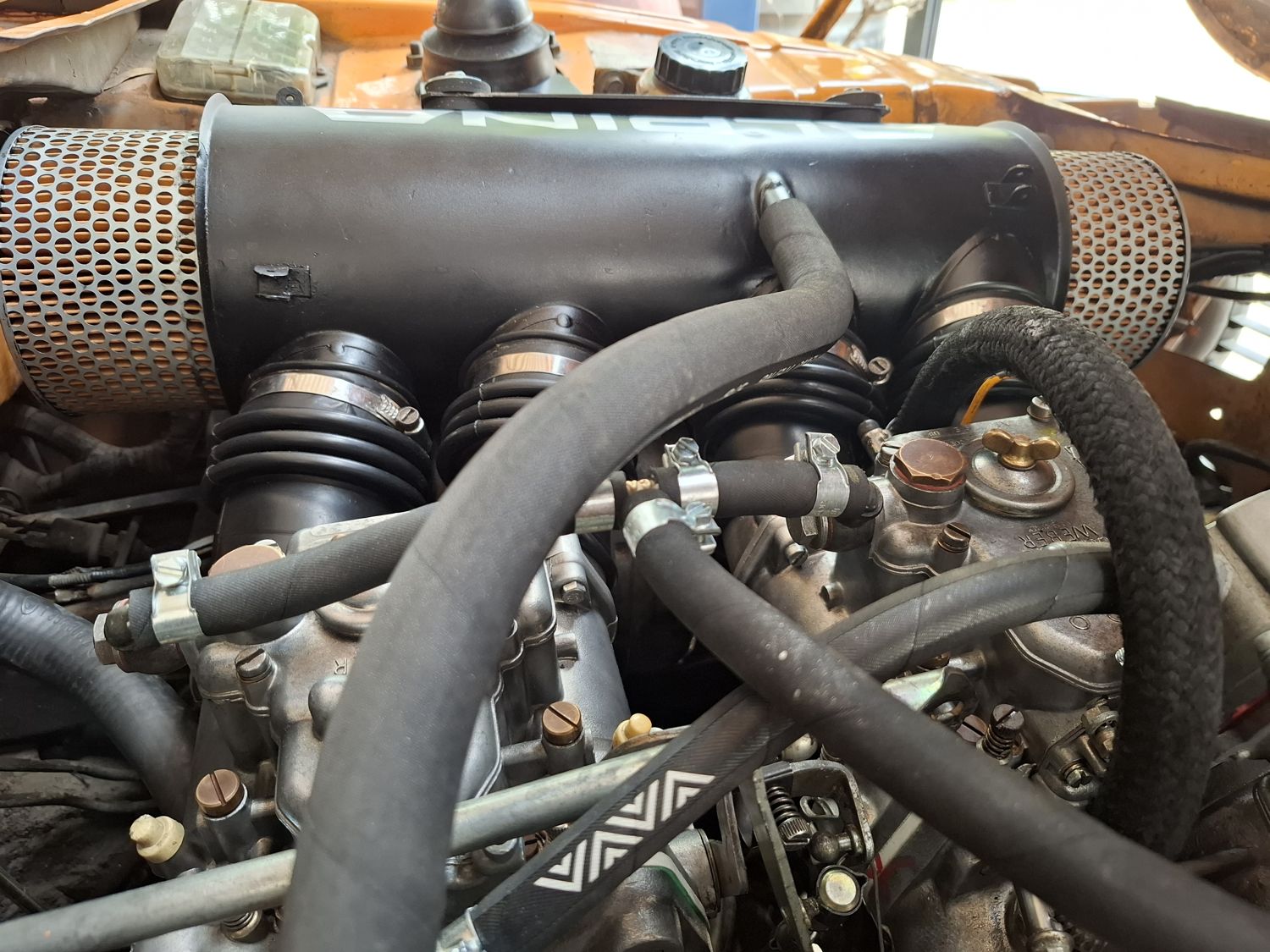 Hoses and linkage under the box