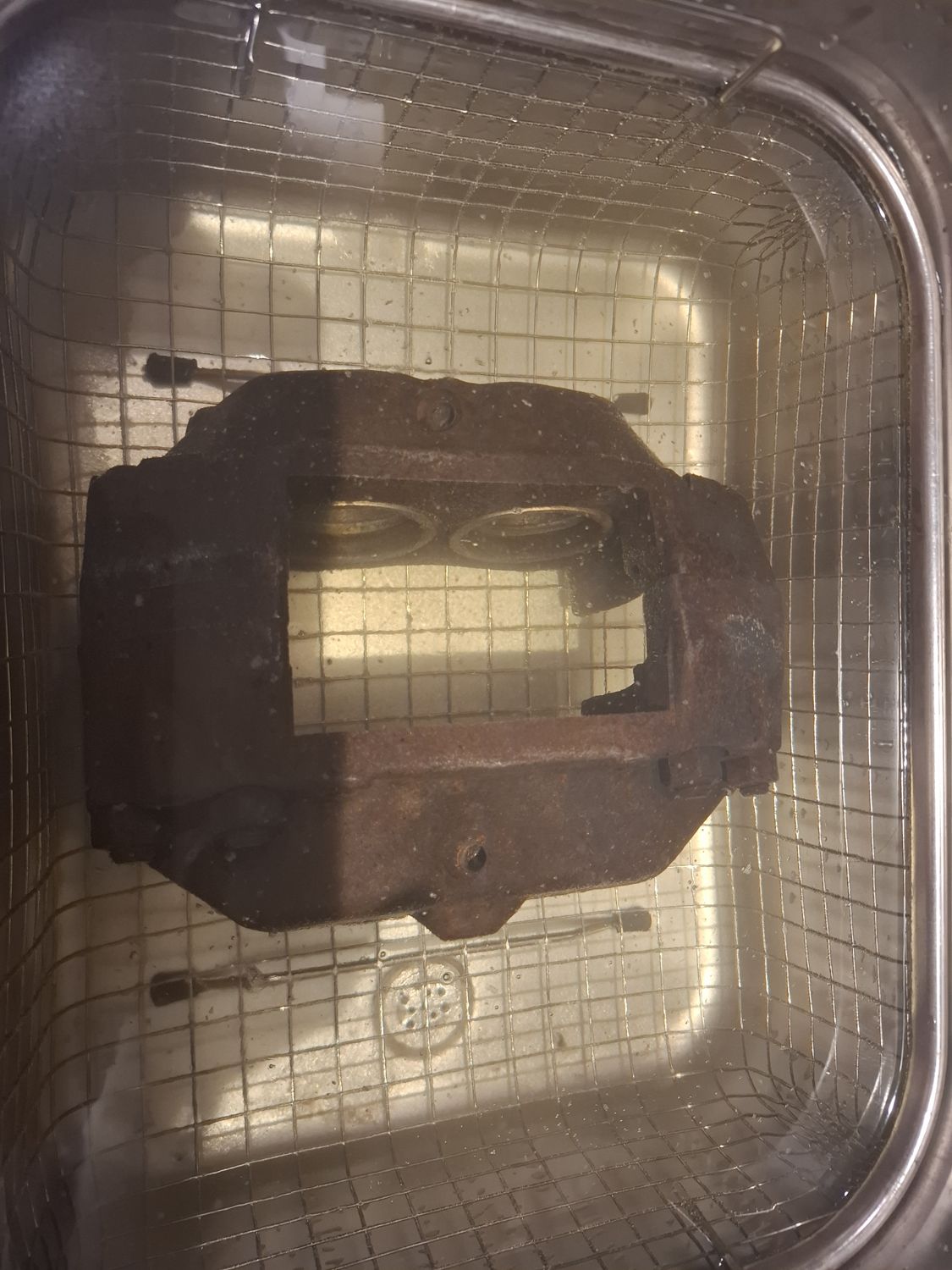 Old caliper in the ultrasonic bath